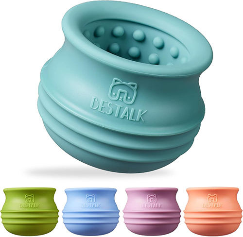 A dog and puppy lick bowl