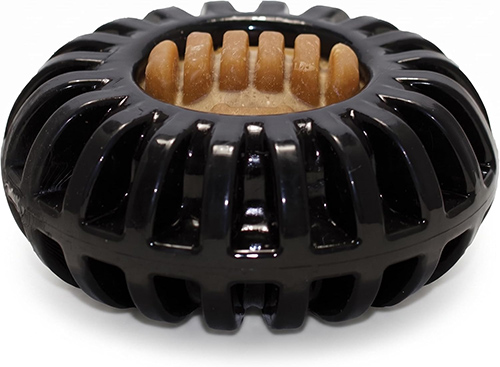 A round, flat plastic treat toy for dogs and puppies